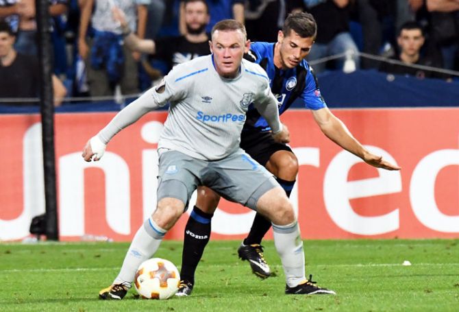 Everton FC's Wayne Rooney and Atalanta's Remo Freuler vie for possession during their UEFA Europa League Group E match at Stadio Citta del Tricolore in Reggio nell'Emilia, Italy, on Thursday