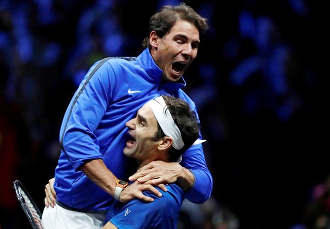 Roger Federer hoists Rafael Nadal