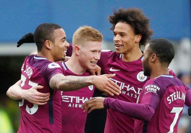Gabriel Jesus is congratulated by teammates Kevin De Bruyne, Raheem Sterling and Leroy Sane after scoring Manchester City's second goal against Everton on Saturday