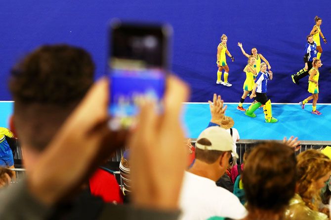 The Australian team wave to the crowd after the Pool B Hockey match between Australia and Canada at Gold Coast Hockey Centre