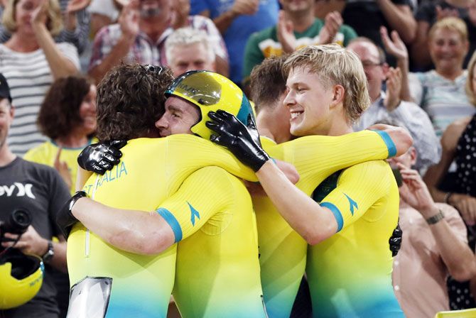 Alex Porter, Sam Welsford, Leigh Howard and Kelland O'Brien of Australia celebrate after winning the gold medal in the Men's 4000m Team Pursuit track cycling final at the Anna Meares Velodrome on Thursday