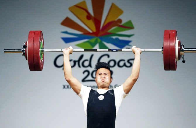 Singapore's En Wei John Cheah in action during the men's 85kg weightlifting final at Carrara Sports Arena 1