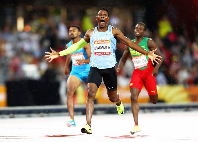Botswana's Isaac Makwala celebrates winning the men's 400 metres gold as he crosses the finish line at Carrara Stadium on Tuesday