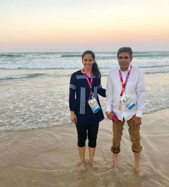 Saina Nehwal and her father Harvir Singh Nehwal wet their feet at Surfers Paradise Beach at Gold Coast