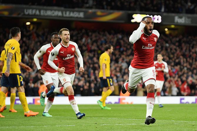 Arsenal's Alexandre Lacazette celebrates after scoring the opening goal against Atletico Madrid