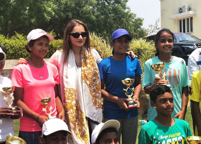Sania Mirza poses for photographs with the young winners of the All India Tennis Ranking Tournament in Hyderabad