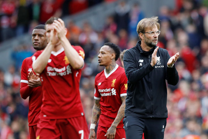 Liverpool manager Juergen Klopp applauds fans after the match