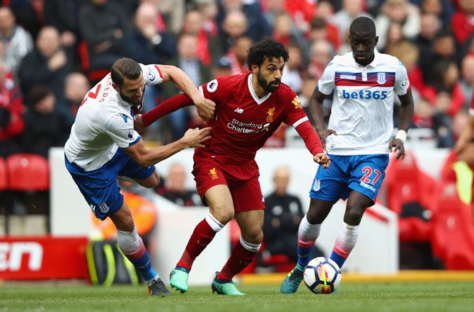 Liverpool's Mohamed Salah goes past Stoke City's Erik Pieters during their English Premier League match at Anfield in Liverpool on Saturday