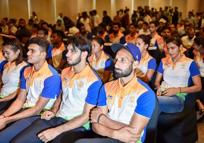 India hockey player Sardara Singh and other members of the Indian contingent for the Asian Games 2018, during their send-off ceremony in New Delhi on Friday
