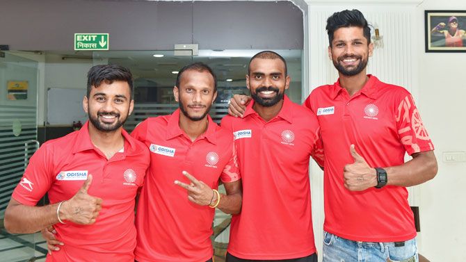 Indian hockey team captain PR Sreejesh (2nd from right) Rupinder Pal Singh (right), Sunil Sowmarpet Vitalacharya (2nd from left) and Harmanpreet Singh pose for a group photo before leaving for the Asian Games, in New Delhi on Monday
