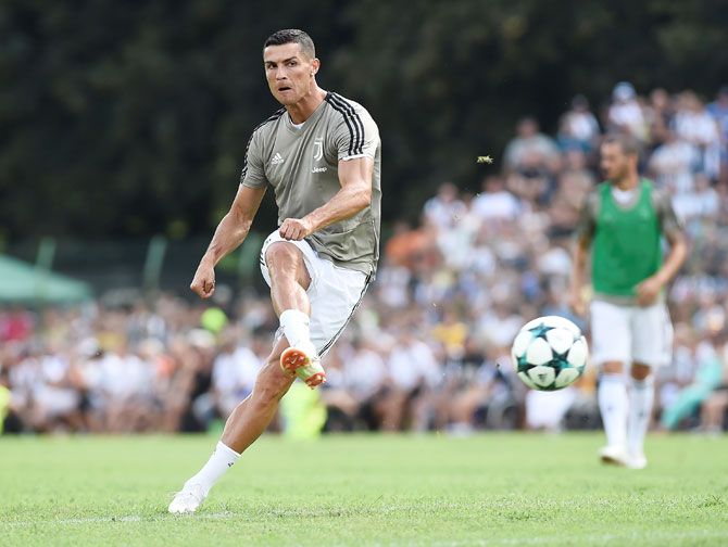 Juventus' Cristiano Ronaldo warms up before a matc