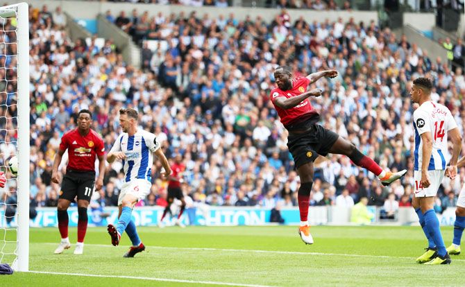 Manchester United's Romelu Lukaku scores his team's first goal against Brighton & Hove Albion