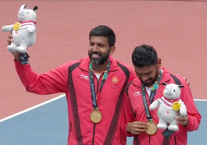 India's Rohan Bopanna and Divij Sharan at the medal ceremony after winning gold at the Asian Games on Friday