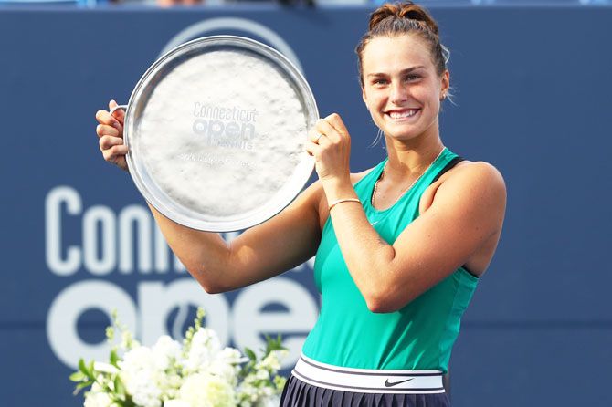 Belarus' Aryna Sabalenka celebrates with her trophy after defeating Spain's Carla suarez Navarro in the Connecticut Open final at Connecticut Tennis Center at Yale in New Haven, Connecticut, on Saturday