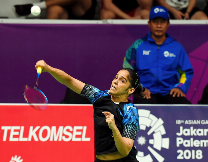 Indian shuttler Saina Nehwal in action against Thailands R Intanon during their women's singles quarter-final badminton match at the 18th Asian Games in Jakarta, Indonesia on Sunday