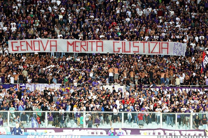 Fans of ACF Fiorentina hold up a banner in memory of the tragedy of the Morandi bridge collapse in Genoa during the serie A match at Stadio Artemio Franchi in Florence, Italy, on Sunday