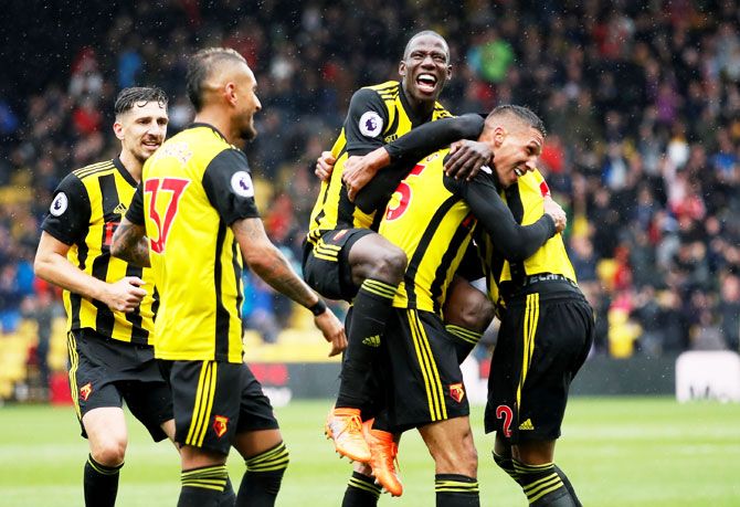 Watford's Jose Holebas celebrates scoring their second goal with team mates during their match against Crystal Palace on Sunday. Watford have a 100 per cent record winning all three of their matches played so far this season