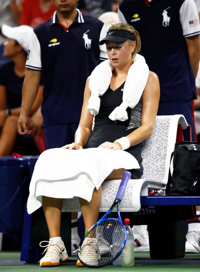 Russia's Maria Sharapova cools down during her ladies singles first round match against Switzerland's Patty Schnyder on Tuesday