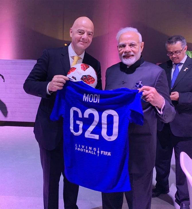 FIFA president Gianni Infantino gives PM Modi a personalised jersey at the G20 Summit in Buenos Aires on Saturday 
