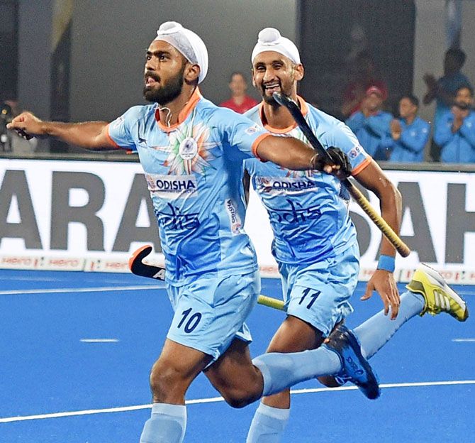 Indian hockey player Simranjeet Singh celebrates a goal during a match against Belgium during the Men's Hockey World Cup in Bhubaneswar on Sunday