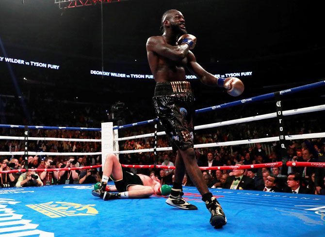 Deontay Wilder reacts after knocking down Tyson Fury during the WBC World Heavyweight Title bout at Staples Centre, Los Angeles on Saturday