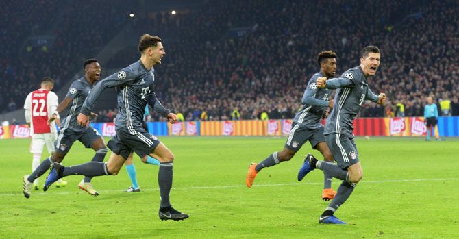 Bayern Munich's Robert Lewandowski celebrates scoring their second goal against Ajax Amsterdam during their Group E match on Wednesday