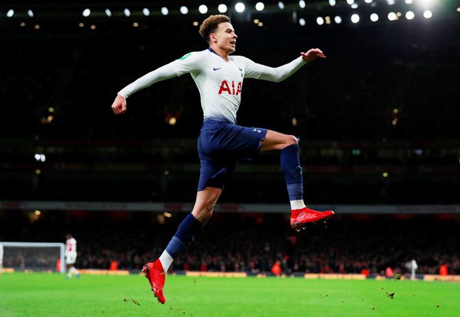 Tottenham's Dele Alli celebrates scoring their second goal against Arsenal during the League Cup quarter-finals at Emirates Stadium in London on Wednesday