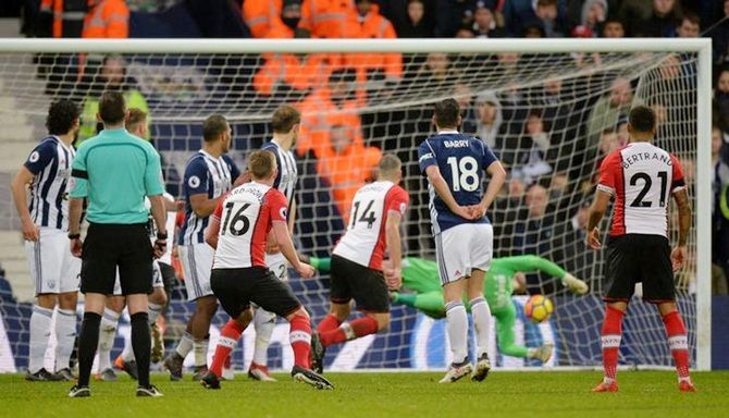 James Ward-Prowse (No. 16) scores Southampton's third goal from a free-kick