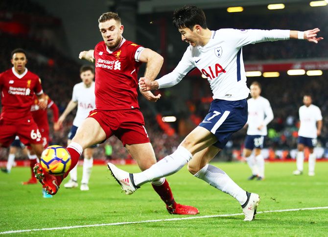 Tottenham Hotspur's Heung-Min Son attempts to cross as Liverpool's Jordan Henderson blocks his attempt