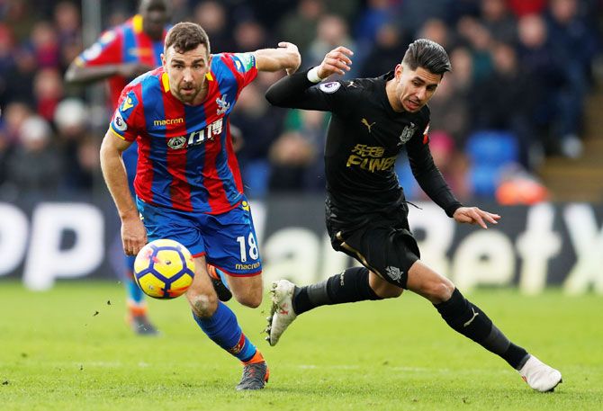 Crystal Palace's James McArthur and with Newcastle United's Ayoze Perez vie for possession