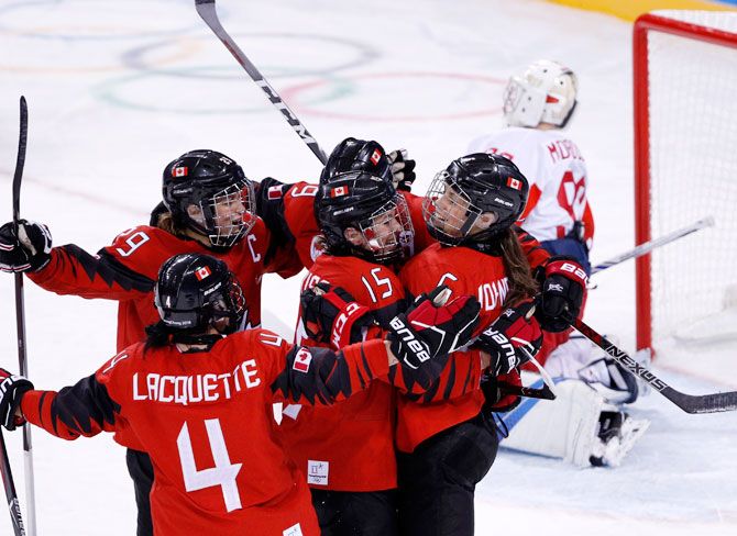 Rebecca Johnston of Canada celebrates a goal with her teammates during the Women Preliminary Round Match against Olympic Athletes from Russia at Gangneung Hockey Centre in Gangneung in South Korea on Sunday
