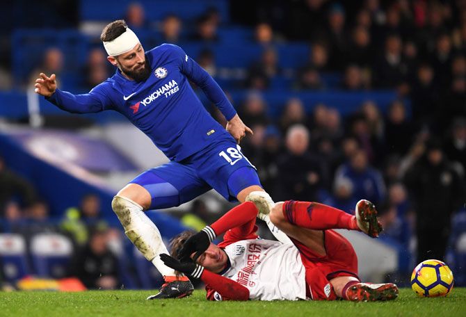 Chelsea's Olivier Giroud is challenged by West Bromwich Albion's Grzegorz Krychowiak