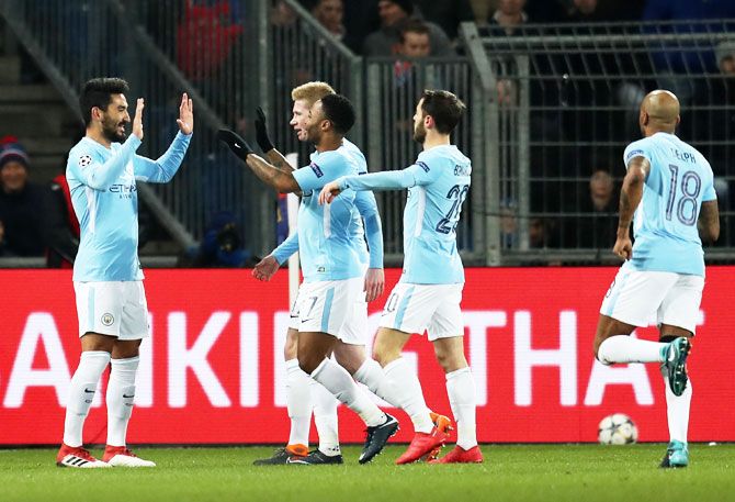 Manchester City's Ilkay Gundogan (left) celebrates with teammates after scoring a goal against FC Basel at St. Jakob-Park in Basel, Switzerland, on Tuesday