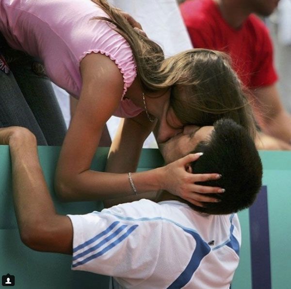 Novak Djokovic and his wife Jelena share a kiss