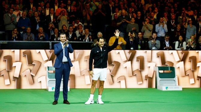  Roger Federer and Tournament Director Richard Krajicek, left, acknowledge the audience at the ATP 500 - Rotterdam Open