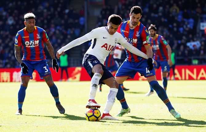 Tottenham's Dele Alli is challenged by Crystal Palace's Luka Milivojevic and Patrick van Aanholt
