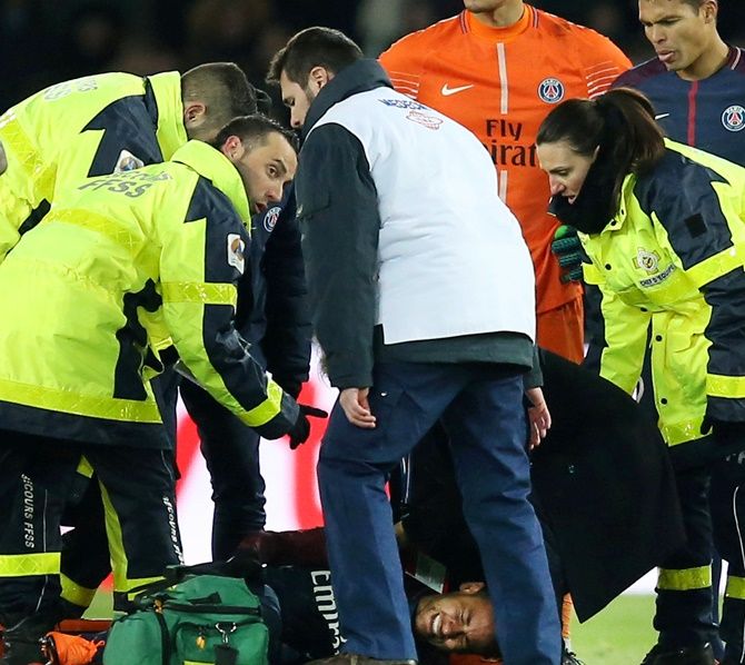  Paris Saint-Germain’s Neymar is put onto a stretcher by medical staff after sustaining an injury on Sunday