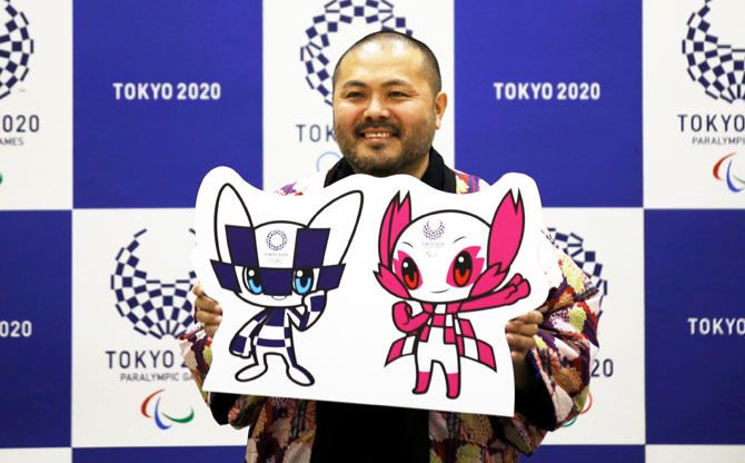 The designer of winning mascots Ryo Taniguchi poses for a photograph during a news conference after Tokyo Olympics organisers unveiled the mascots for the Tokyo 2020 Olympics and Paralympics selected by popular vote by elementary students across Japan