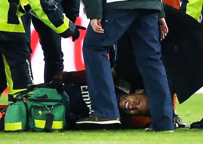 Paris Saint-Germain’s Neymar receives treatment from medical staff after sustaining an injury during their Ligue 1 match against Olympic Marsielle at Parc des Princes Stadium in Paris on Sunday