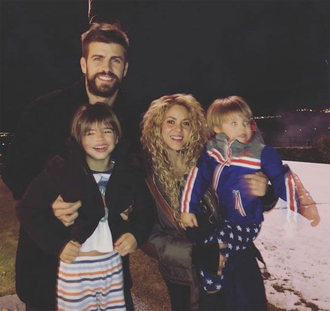 Barcelona defender Gerard Pique and girlfriend singer Shakira and their two kids took to Instagram to wish fans 'A Happy 2018' 
