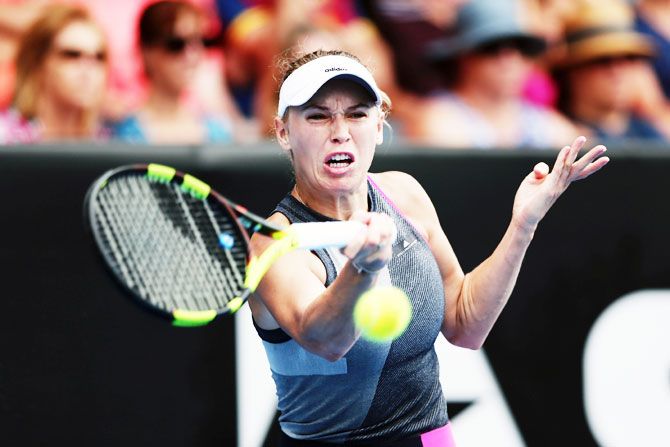 Denmark's Caroline Wozniacki plays a forehand in her match against Croatia's Petra Martic on Day 3 of the ASB Women's Classic at ASB Tennis Centre in Auckland, New Zealand, on Wednesday