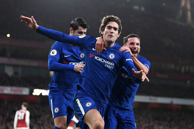Chelsea's Marcos Alonso celebrates with teammate Danny Drinkwater after scoring his side's second goal