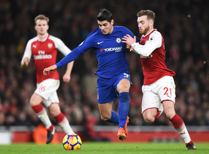 Chelsea's Alvaro Morata and Arsenal's Calum Chambers battle for possession