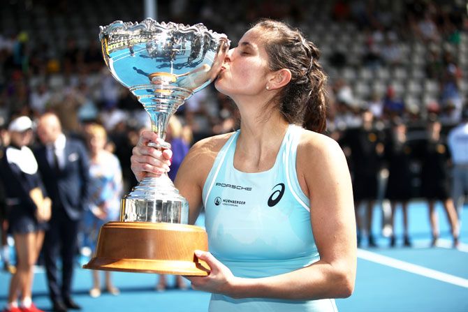 Germany's Julia Gorges poses with the trophy after defeating Denmark's Caroline Wozniaki to win the ASB Women's Classic final at ASB Tennis Centre in Auckland on Sunday