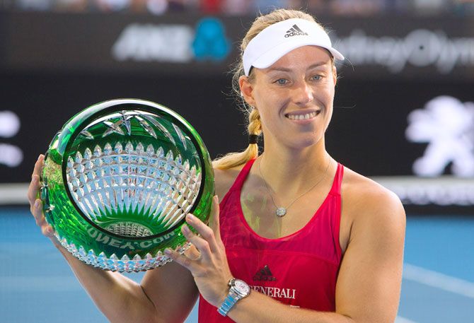 Germany's Angelique Kerber holds the trophy after winning the Sydney International final against Australia's Ashleigh Barty at Sydnet Olympic Park on Saturday
