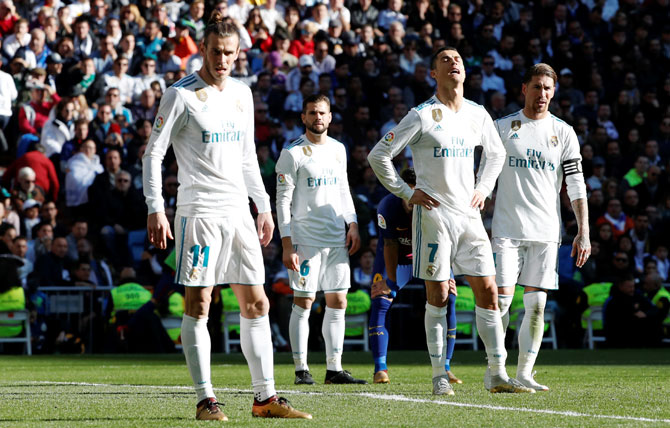 Real Madrid’s Gareth Bale, Cristiano Ronaldo and Sergio Ramos react