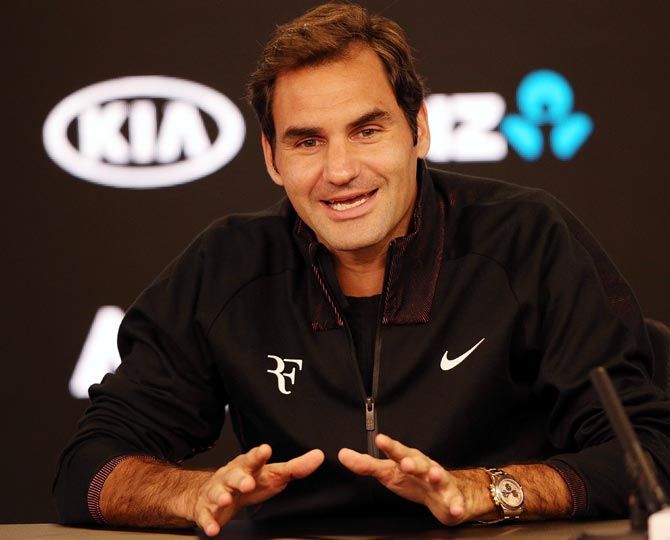 Roger Federer speaks to the media