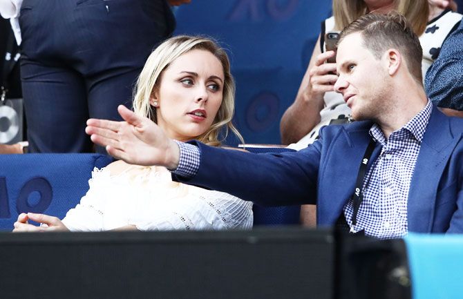 Australia's cricket captain Steve Smith probably telling his fiancee Dani Willis which way Djokovic should have played a shot