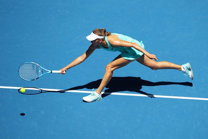 Elise Mertens plays a forehand in her quarter-final match against Elina Svitolina