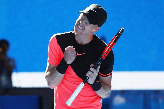 Great Britain's Kyle Edmund celebrates winning match point in his quarter-final against Bulgaria's Grigor Dimitrov at Melbourne Park on Tuesday